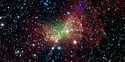 La nébuleuse de l'Haltère en infrarouge par le télescope spatial Spitzer.