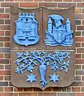 Blason de Siemensstadt, représentant l'immeuble Werner, composé du blason du quartier de Charlottenburg, de celui du quartier de Spandau et de celui des barons von Siemens.