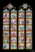 Dans le chœur à gauche, les deux vitraux du Nouveau Testament.