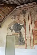 Peinture murale en façade ouest : saint Christophe (XVe&nbsp;siècle).