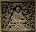 Les assauts de Mâra (les armées de Mâra). Relief sur schiste, 52,6&nbsp;×&nbsp;59&nbsp;cm. Gandhara, IIIe&nbsp;siècle. Musée d'art asiatique de Berlin Dahlem.